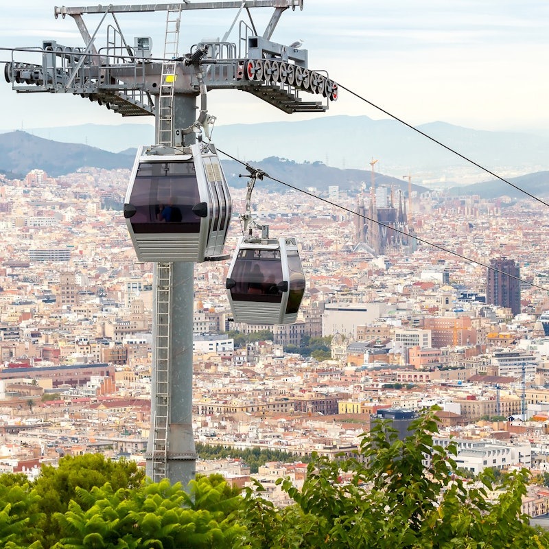 Barcelona's cable car with the city skyline in the background